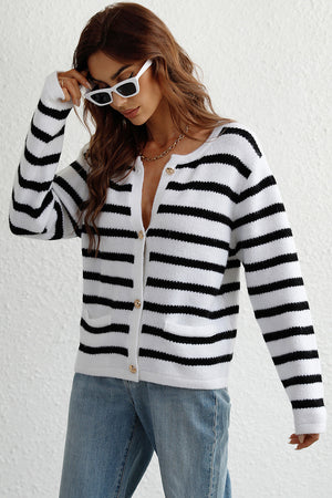 White and black striped knit cardigan with gold buttons and pockets