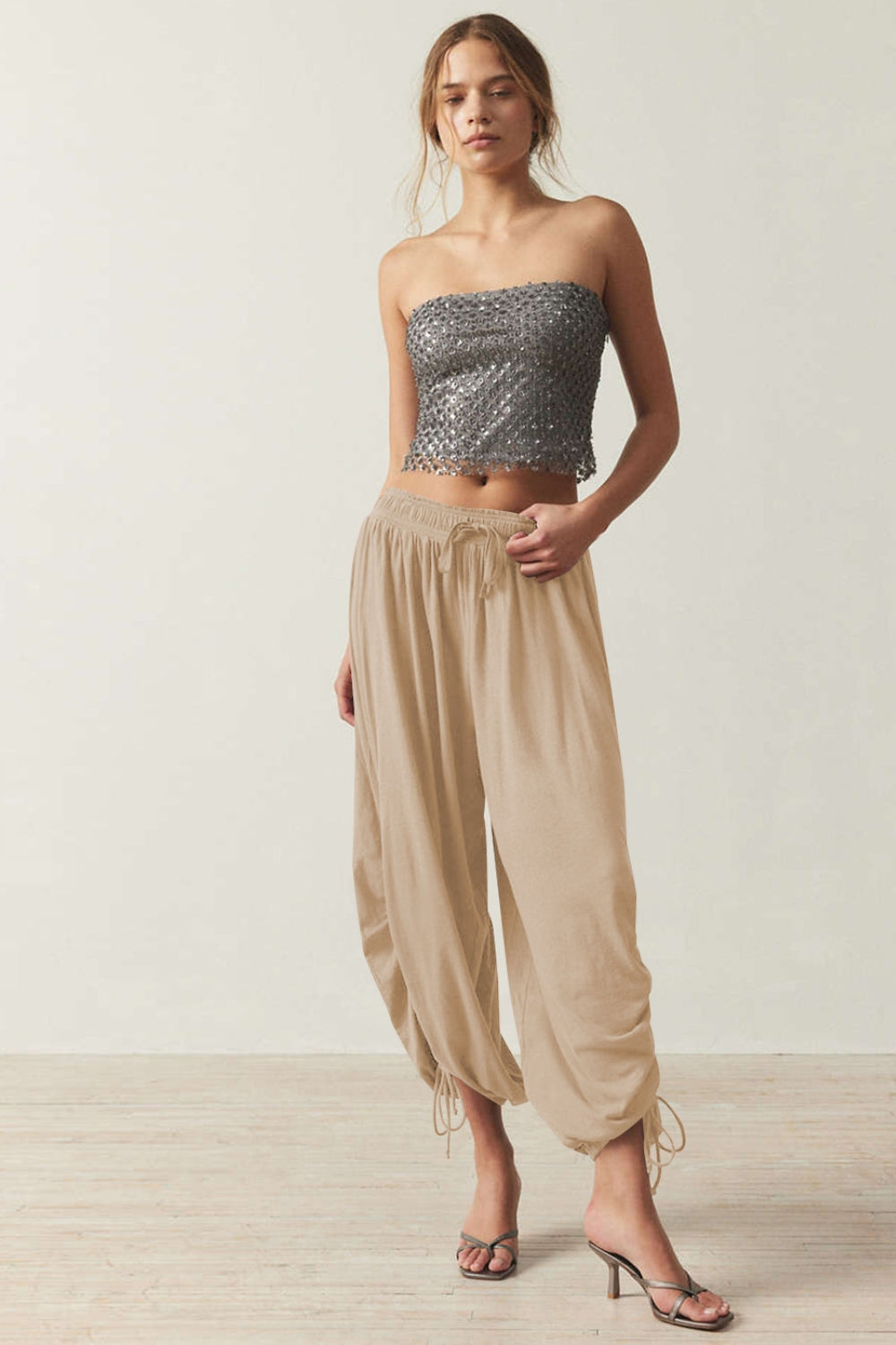 Tan gathered ankle-tie balloon trousers with drawstring waist