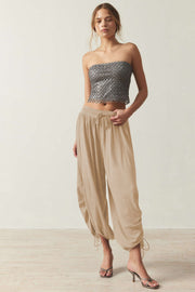 Tan gathered ankle-tie balloon trousers with drawstring waist