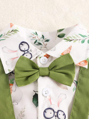 Baby cotton shirt with bunny and carrot print, green bow tie, and suspenders.