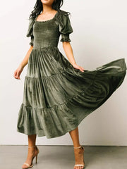 Velvet smocked midi dress in army green with ruffled sleeves and tiered skirt.