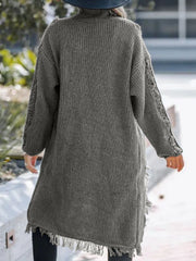 Gray acrylic maxi cardigan with textured knit, fringe hem, and openwork sleeves.