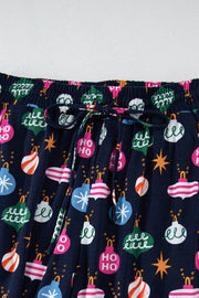 Navy blue lounge pants with festive bauble print and drawstring waist.
