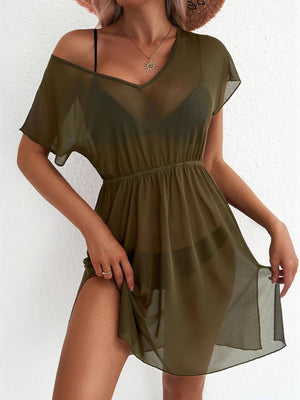 Green sheer mini dress with V-neck, short sleeves, elastic waist, and high slit.