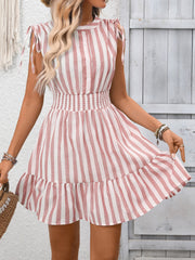 Pink striped summer dress with tied shoulders, smocked waist, and ruffled hem.