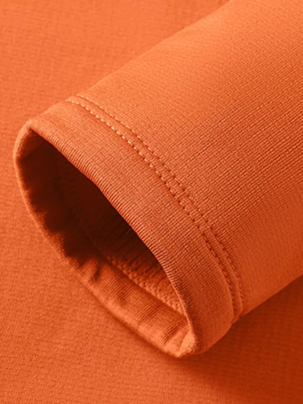 Orange long sleeve undershirt with crew neck and double-stitched cuff detail