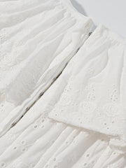 White eyelet tank top with ruffle trim and corset detail