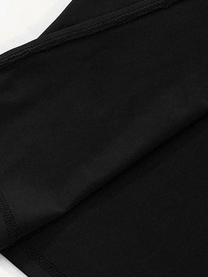 Black off-shoulder maxi dress detail showing fabric texture and stitching.