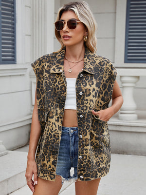 Leopard print denim utility vest with button front and chest pockets.