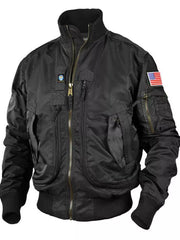 Black bomber jacket with multiple zip pockets, US flag patch, and ribbed cuffs.