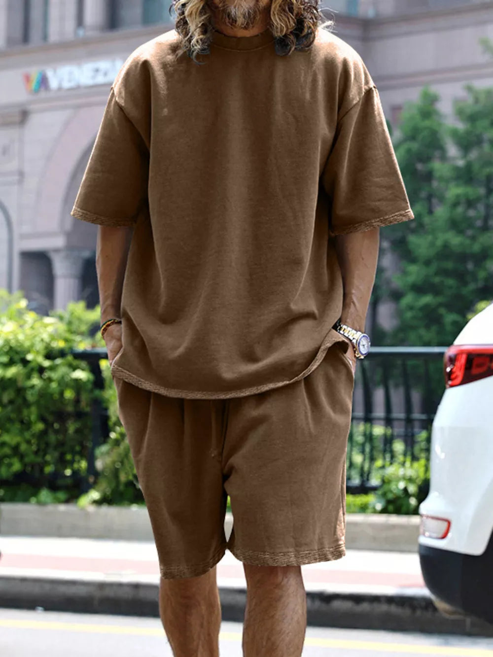 Men's brown relaxed fit two-piece set with drawstring shorts and short sleeve tee.