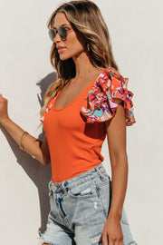 Orange ribbed bodysuit with floral ruffle sleeves and scoop neck.