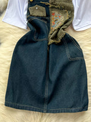 Denim overall dress with white tee, distressed details and embroidered patch.