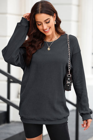 Dark Gray textured ribbed crewneck pullover sweater with long sleeves and a relaxed fit.