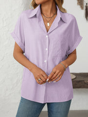 Cuffed sleeve button-down shirt in pastel yellow with vertical pinstripes and a chest pocket.
