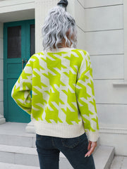 Geometric houndstooth knit cardigan in lime and white acrylic with V-neck and ribbed trim.