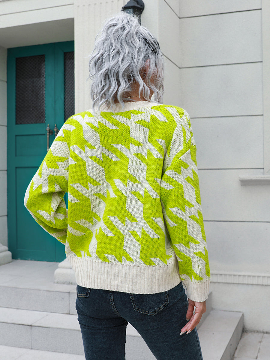 Geometric houndstooth knit cardigan in lime and white acrylic with V-neck and ribbed trim.