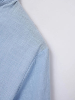 Light blue linen henley polo shirt with textured weave detail