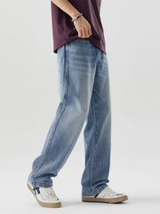 Men's relaxed fit blue washed cotton jeans with a casual style.