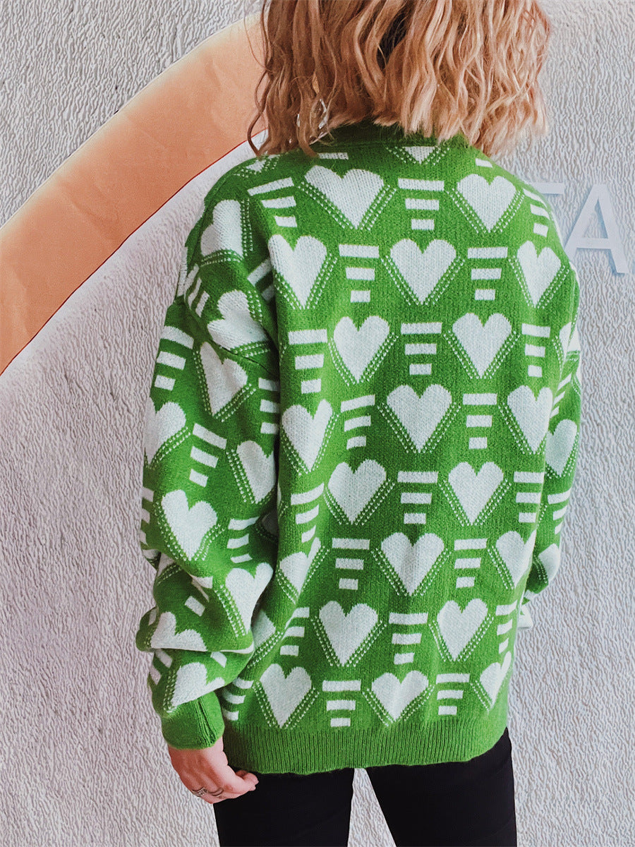 Neon green acrylic knit jumper with white geometric heart pattern.