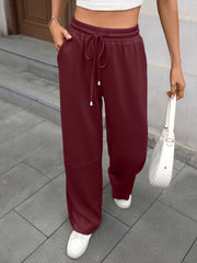 Wine Red high-waist drawstring wide-leg pants with pockets and a relaxed fit.