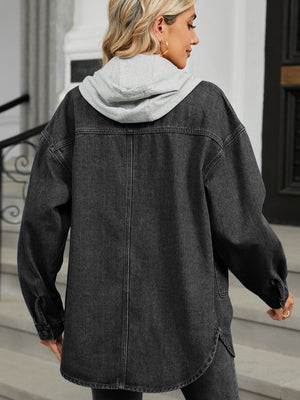 Black oversized denim jacket with hood and buttoned cuffs, casual trucker style.