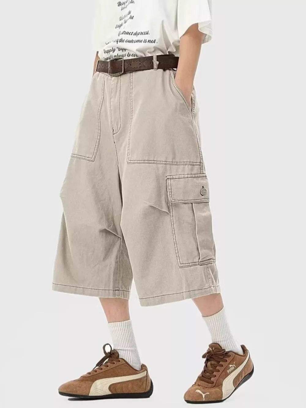 Relaxed fit khaki cargo cropped sweatpants with large side pockets and contrast stitching.