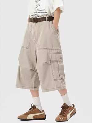Relaxed fit khaki cargo cropped sweatpants with large side pockets and contrast stitching.