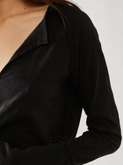 Black slouchy tee with plunge neckline and distressed details.