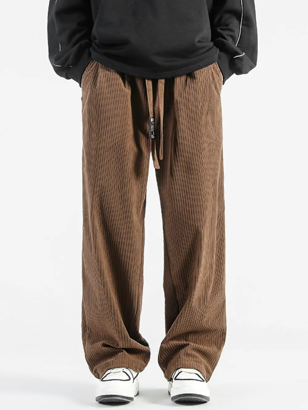 Brown corduroy wide-leg sweatpants with drawstring waist and pockets.