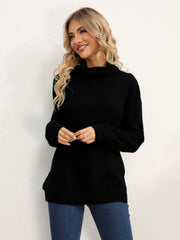 Black textured knit oversized turtleneck pullover sweater with ribbed details.