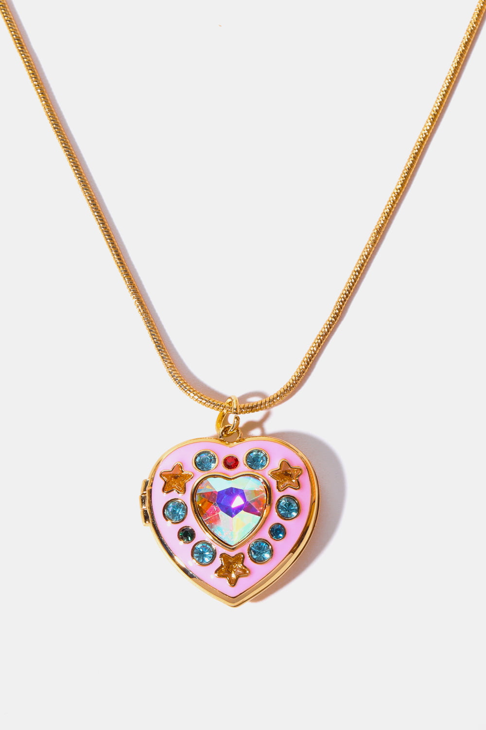 Gold locket heart pendant with iridescent gem, pink enamel, blue gems, and star accents.