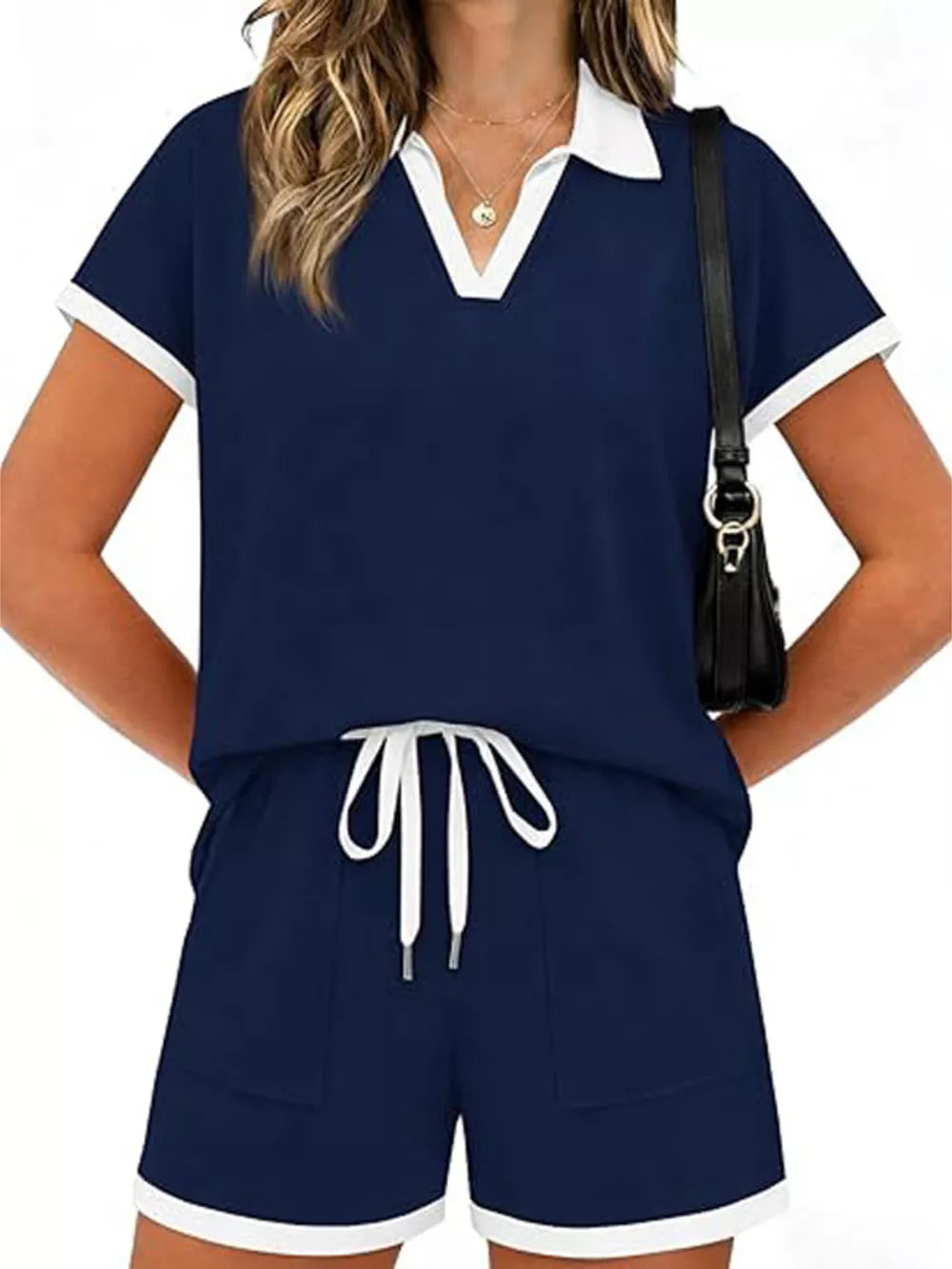 Navy blue polo collar two-piece set with white trim and drawstring shorts.
