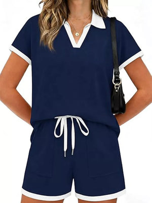 Navy blue polo collar two-piece set with white trim and drawstring shorts.