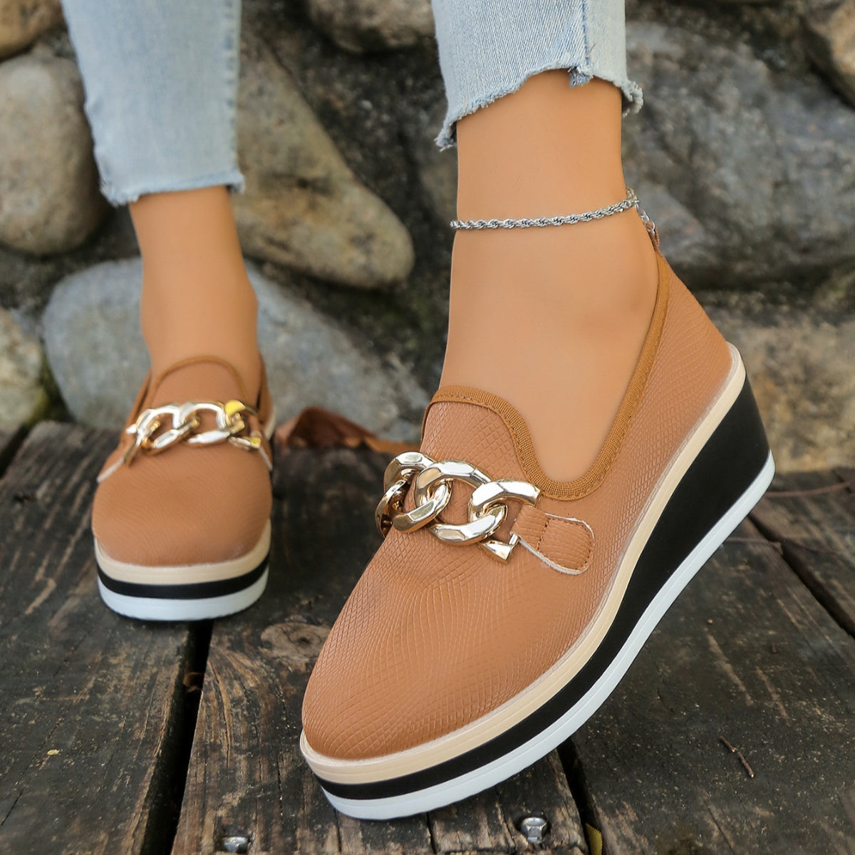 Brown chain decor wedge loafers with a textured finish and layered sole.