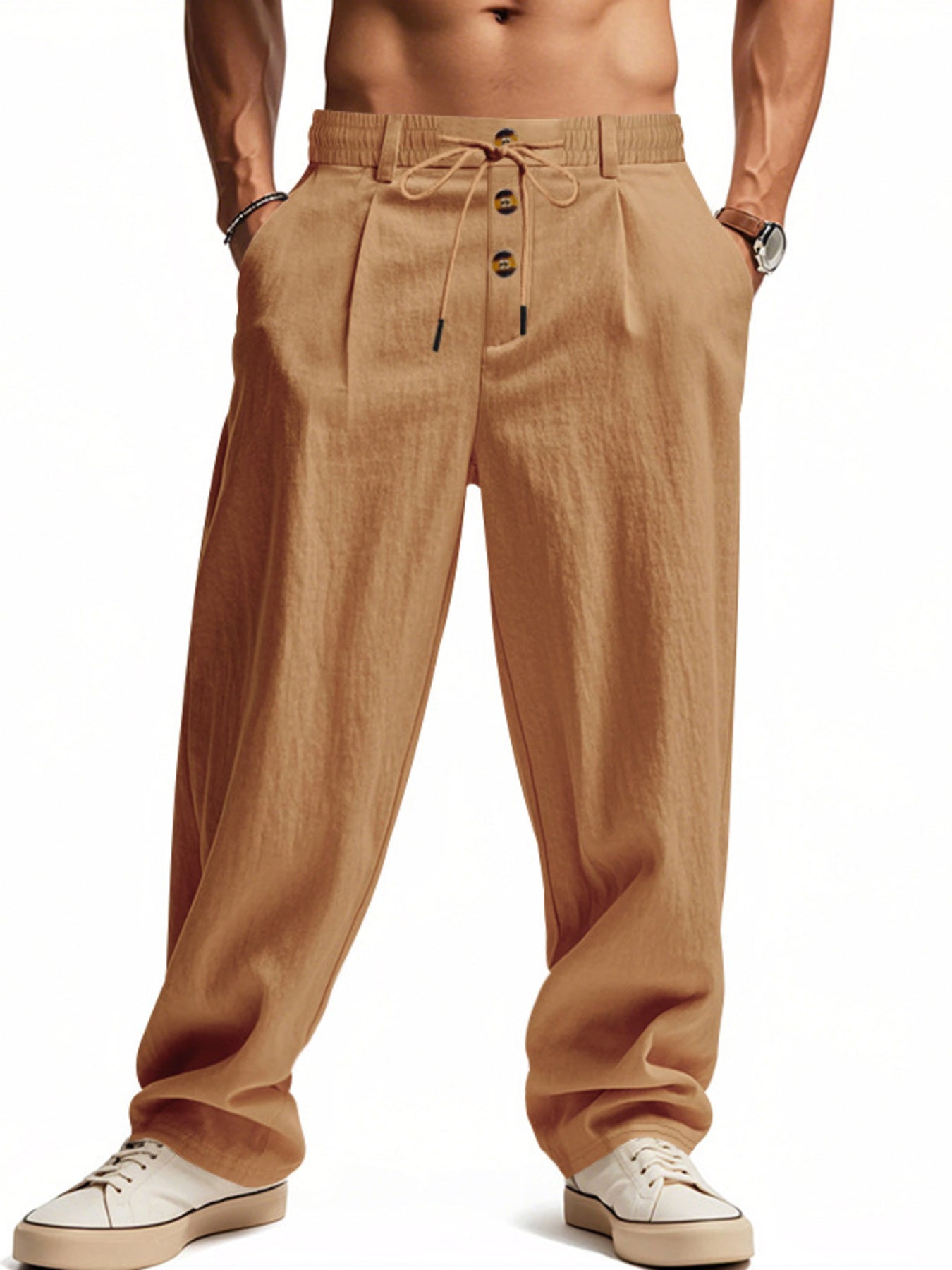 Men's loose fit drawstring pants in earthy yellow with button fly and pleated front.