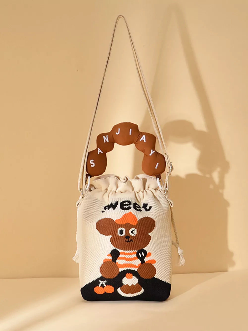 Drawstring Bucket Crossbody Bag in Style D, model styling view