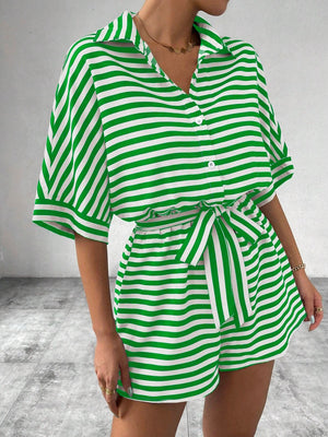 Green and white striped button-front romper with short sleeves and a self-tie belt.
