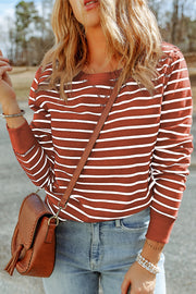 Nautical stripe crewneck sweatshirt in red orange with white stripes, crew neckline, and long sleeves.