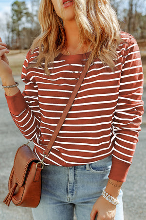 Nautical stripe crewneck sweatshirt in red orange with white stripes, crew neckline, and long sleeves.