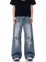 Men's blue distressed wide-leg cotton jeans with ripped details.
