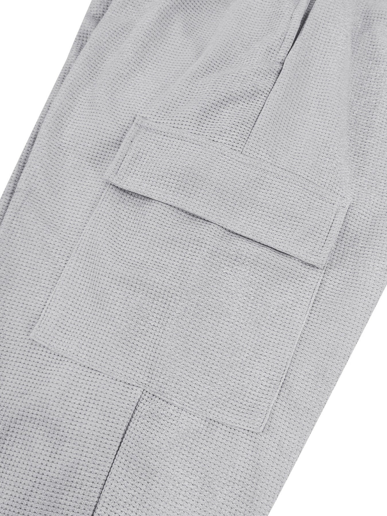 Light gray waffle knit joggers with a flap pocket detail.