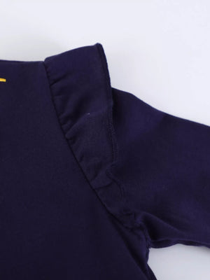 Dark navy baby dress with ruffled shoulder detail and long sleeves.