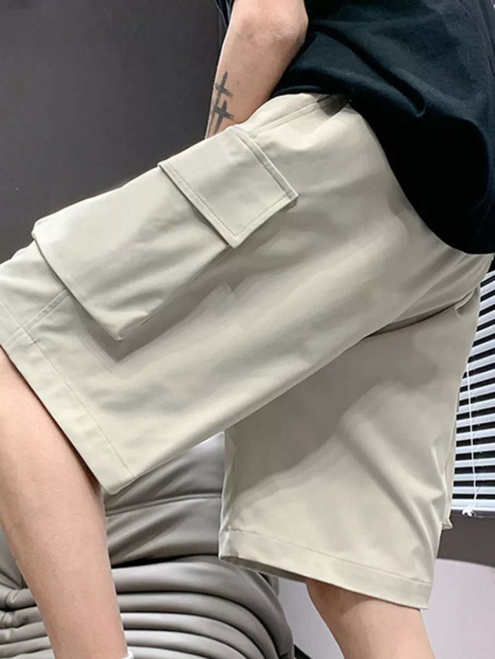 Relaxed fit cargo shorts in apricot with drawstring and flap pocket detail.