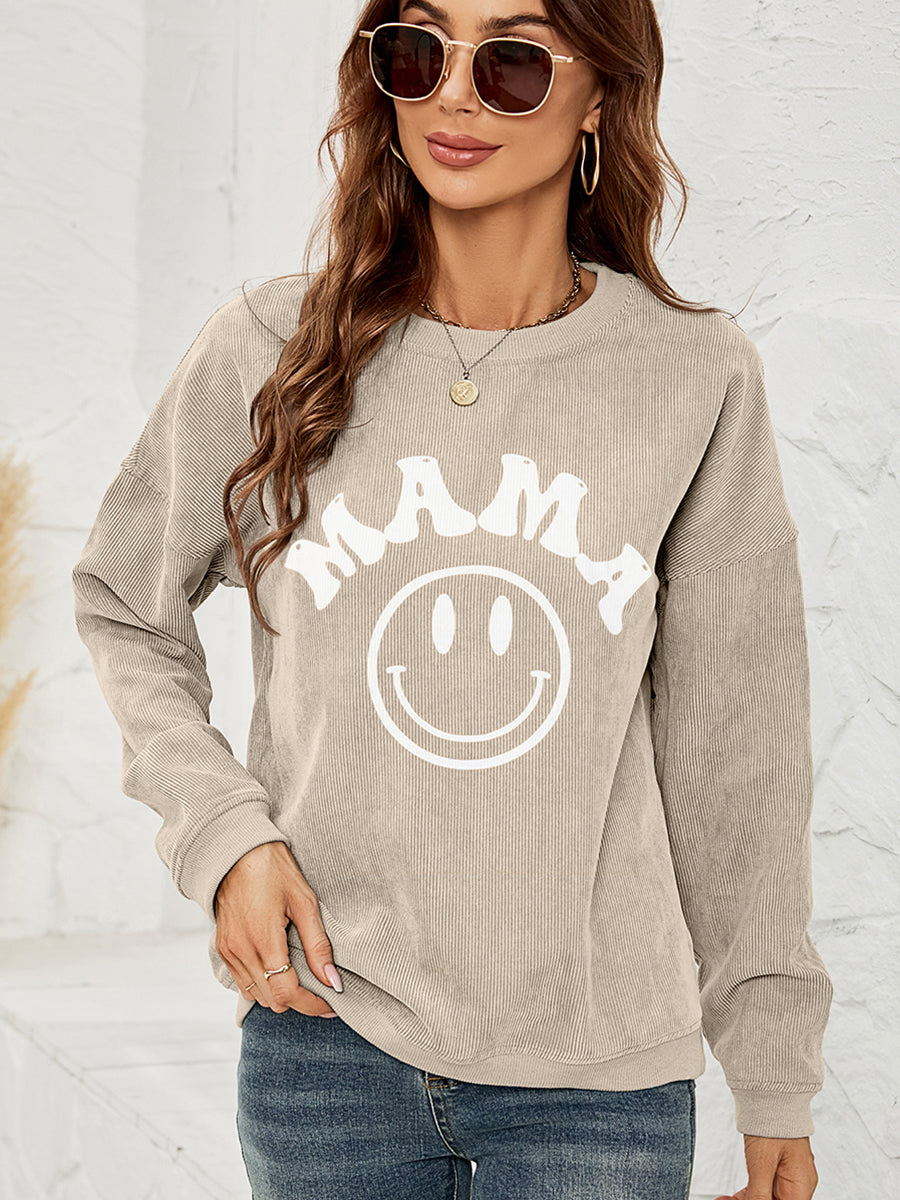 Sand corduroy sweatshirt with white "Mama" smiley graphic and crew neck.