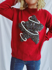 Scarlet knit jumper with embroidered starburst detail and white piping.