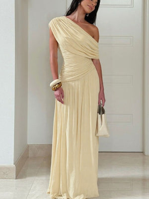 Elegant beige one-shoulder maxi dress with draped bodice and ruching.