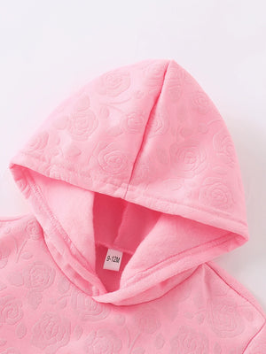 Pink embossed floral baby hoodie with soft lining and size tag.