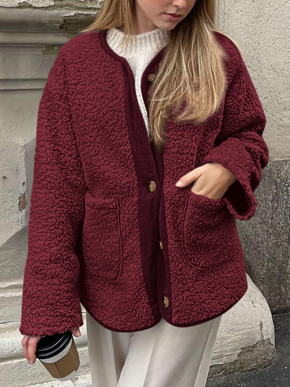 Burgundy teddy-texture button-up jacket with corduroy trim and pockets.