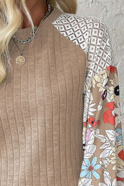 Ribbed tan top with lace and floral print sleeves.